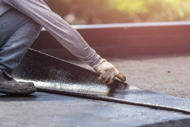 Professional Interior Drainage System technician working in Orient, NY